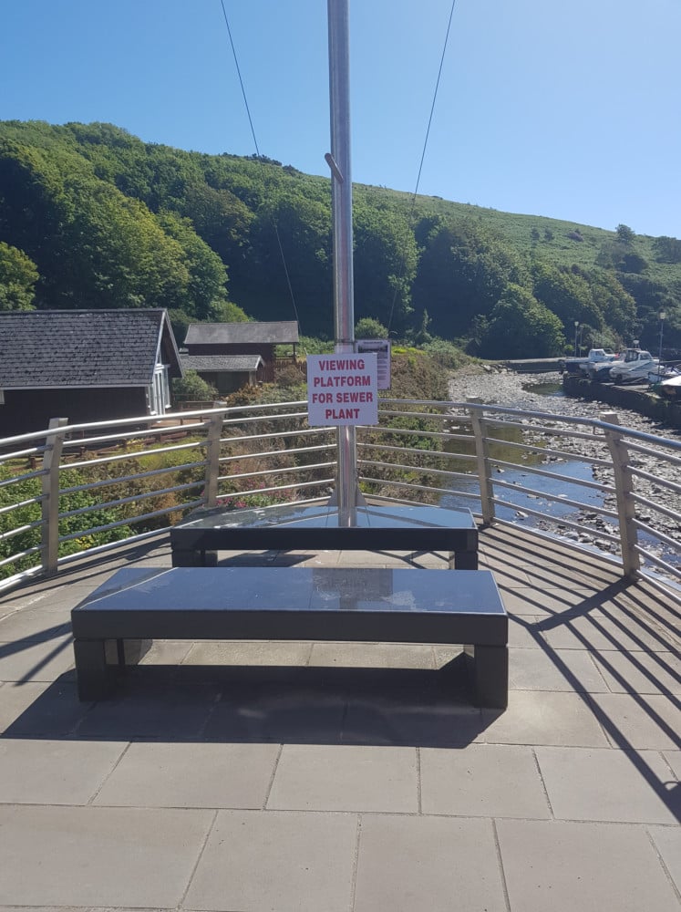 Signs opposing plans to erect new sewage treatment works in Laxey were spotted overlooking the proposed spot