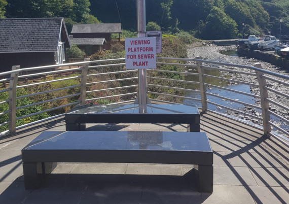 Signs opposing plans to erect new sewage treatment works in Laxey were spotted overlooking the proposed spot