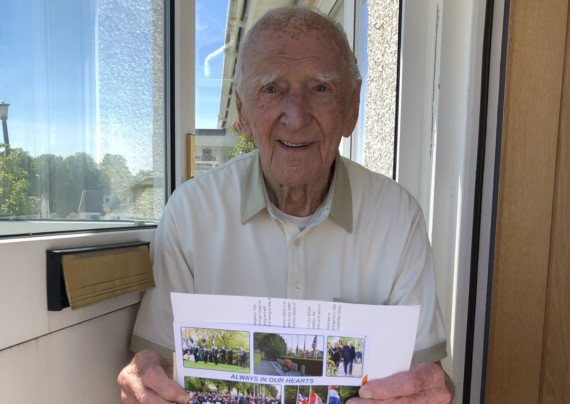 Hector Duff, who fought on D-Day in the Second World War, holding a letter from Ahmed Marcouch, Mayor of Arnhem in the Netherlands