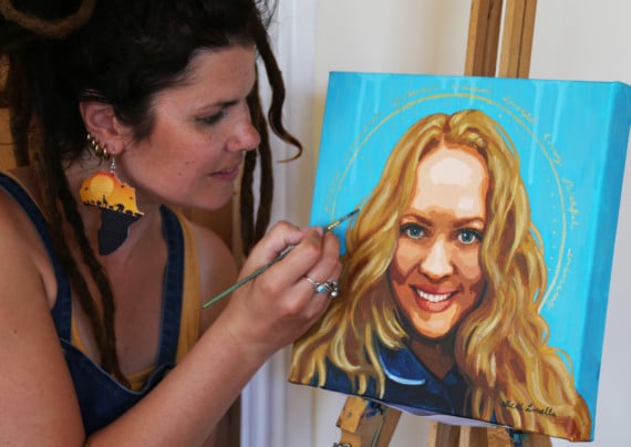 Local artist Beth Loella with her portrait of Manx NHS midwife Bryony Manning