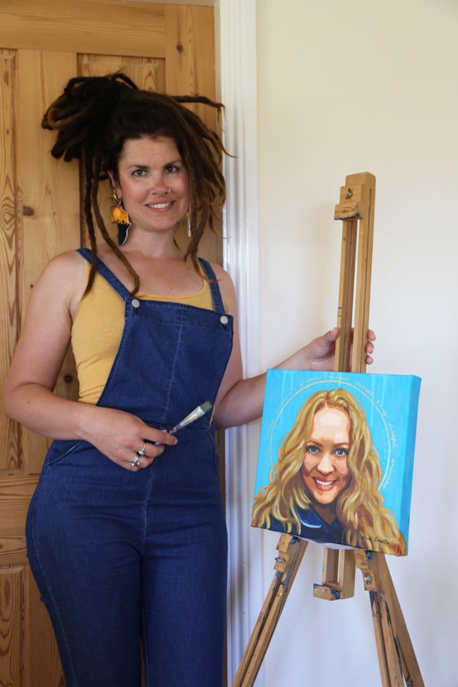 Local artist Beth Loella with her portrait of Manx NHS midwife Bryony Manning