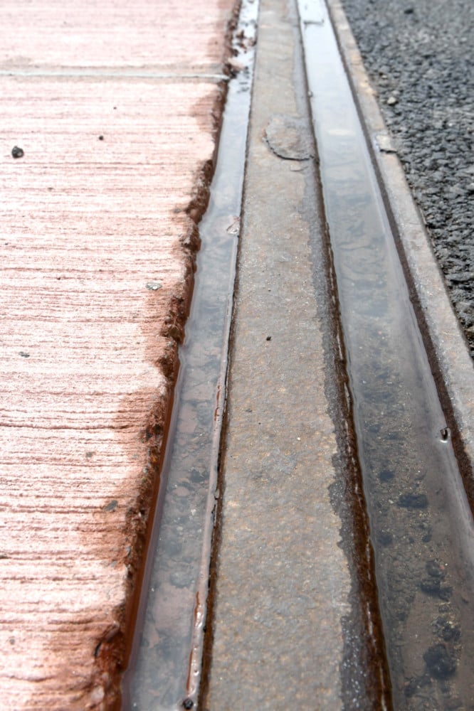 inset, a close up showing the gap running alongside the track