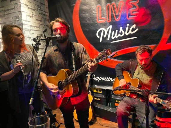 Musicians play at the Quids Inn open mic night