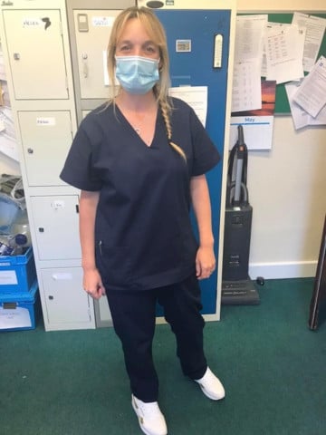 NHS worker Sindy in her scrubs made by stitchers in the island during the Covid-19 pandemic