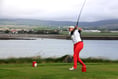 Defending champions remain on course