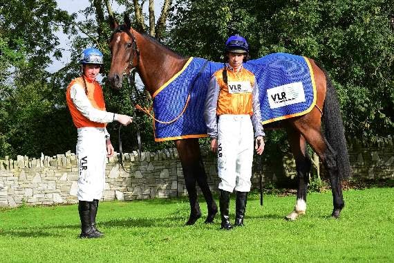 Left to right are Irish jockeys Jack and Paddy Kennedy, with O’Connell Street the racehorse owned by Vincent Caldwell’s mum, Mrs Kathleen Caldwell, and trained by Gordon Elliott