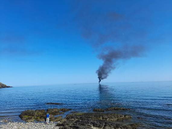 The boat on fire in Douglas bay