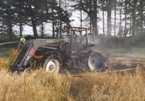 Fire service attend to two burning tractors