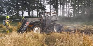 Fire service attend to two burning tractors