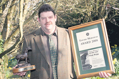 FIRST PRIZE: Farmer Phil Coaker displays his award.