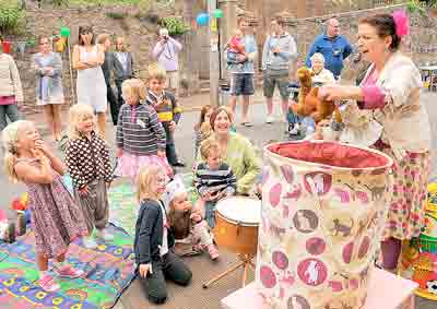 FUN in Higher Brimley Road, Teignmouth, as Sarah Van Veen, of Snazzy Maracas, entertains the children. Contributed picture