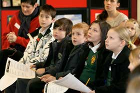 ATTENTION: Children listen to Nicholas’ presentation on Fairtrade principles.<br> Pictures by TJ Macleod