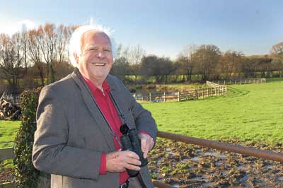 Ed Cose at the field where he spotted the rare visitor.