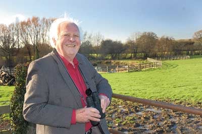 Ed Cose at the field where he spotted the rare visitor.