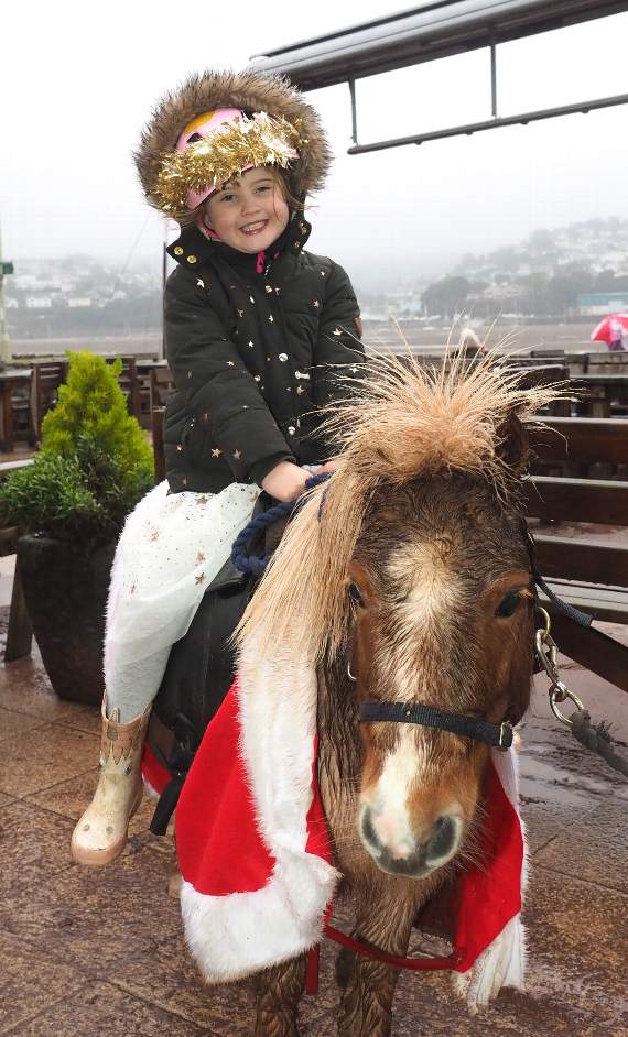 Ottilie Sullivan 4, as Mary, on Ned the Donkey.