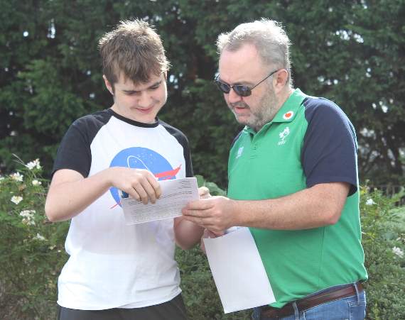 Henry McConville and his dad check out his GCSE grades at South Devon UTC.