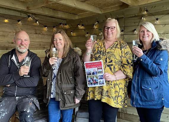 Kingsteignton Town Council had double cause to celebrate. Town Clerk Carol Lakin (pictured left with colleagues) completed 25 years of service.