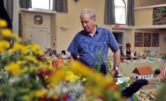 PLENTY TO SEE: Peter Farnsworth admires the floral displays at Highweek Village Hall show.