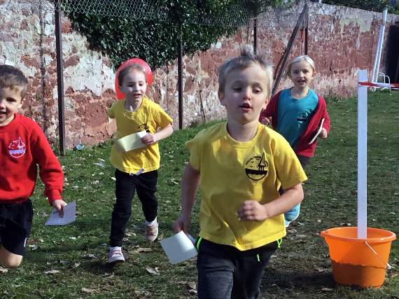 Charlie and children from Shaldon Primary School raising money by running laps of the school.