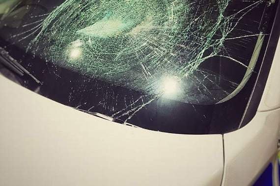 The damaged police car.