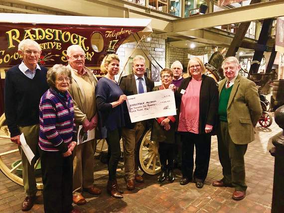 Tom Killen and Nicky Houston, from Killens at Mendip Auction rooms, handing over the cheque for £1,111.45 to the Bygone Days Talks team at Radstock Museum.