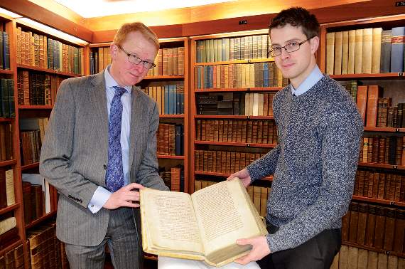 Dr Simon Johnson, Director of Heritage, and Steven Parsons, Downside Abbey Outreach Officer, pictured with one of the rare books that will be on display. Photo: Becky Brooks