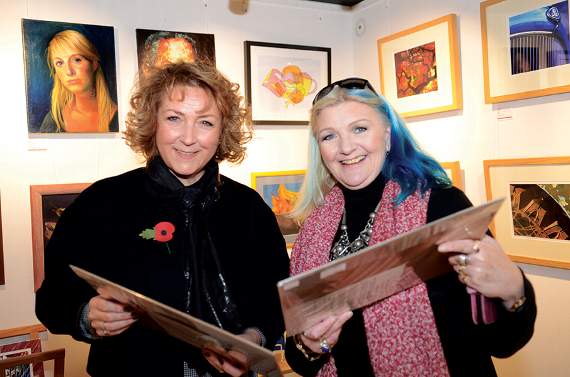 Suzanne Burgess, (Radco Director) and Old Bakery artist, Caroline Walsh-Waring, view some of the artwork on display and for sale.