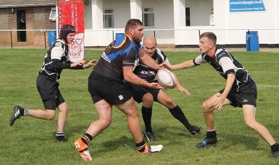 Morgan Freeman (left) Neil Evans and Sam Thomas combine to hold up a Hollybush attack