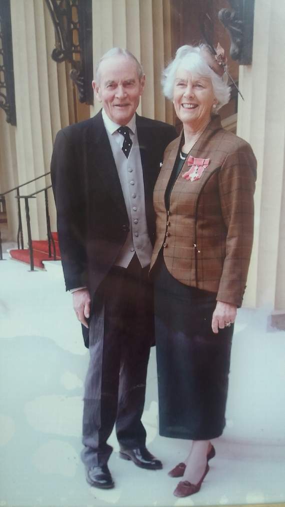 Jenny with late husband Alasdair as she collected her MBE
