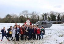Father Christmas drops in to surprise school pupils