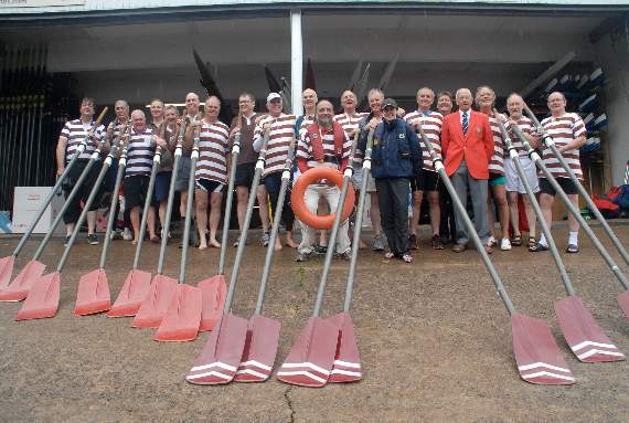 The Monmouth School crews from 1969 and 1976. John Hartland is pictured with the crews (wearing a red jacket)