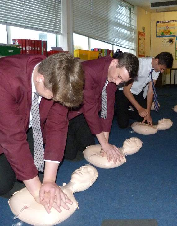 Pupils taking part in life saving defibrillator training