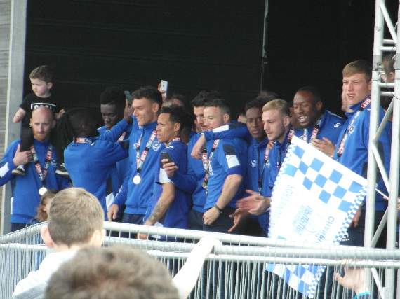 The Pompey players prepare to receive the League Two title
