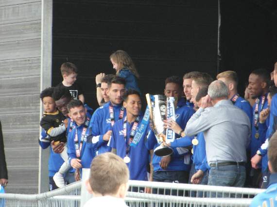 The Pompey players receive the League Two title