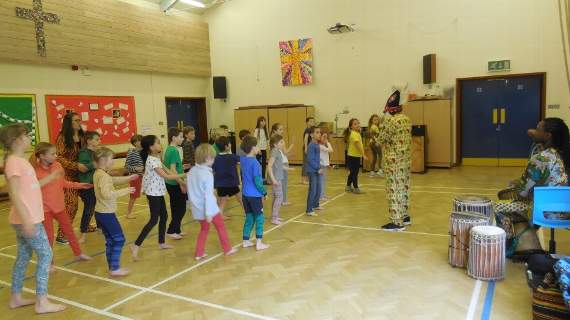 Younger pupils at Harting school enjoying an African drumming class