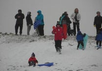 Hundreds of people take to Butser Hill for sledging fun