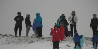 Hundreds of people take to Butser Hill for sledging fun