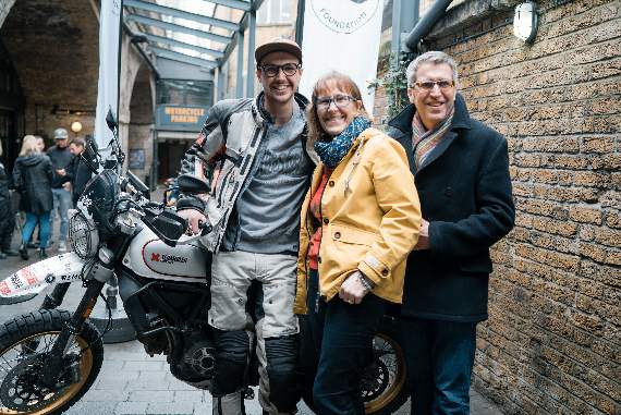 Henry, his mother Alyson, and father Simon, just before Henry left for his world tour