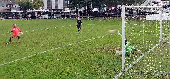Petersfield Town keeper Matt Petts makes his winning penalty save from Farnham Town keeper Richard Ossai