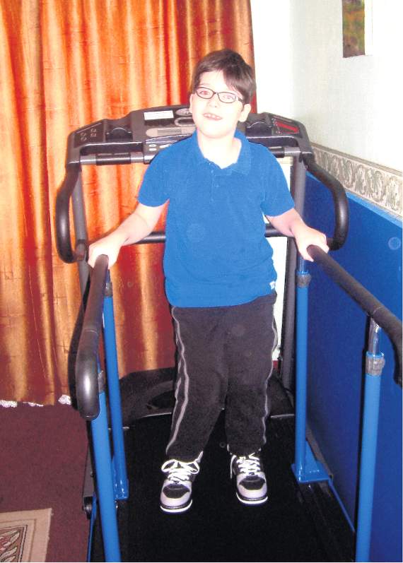 Josh using his adapted treadmill