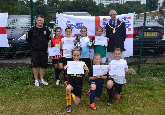 The Ross Juniors Under 10 Girls with their coach, Carl Roberts, and the Mayor of Ross, Cllr Nigel Gibbs