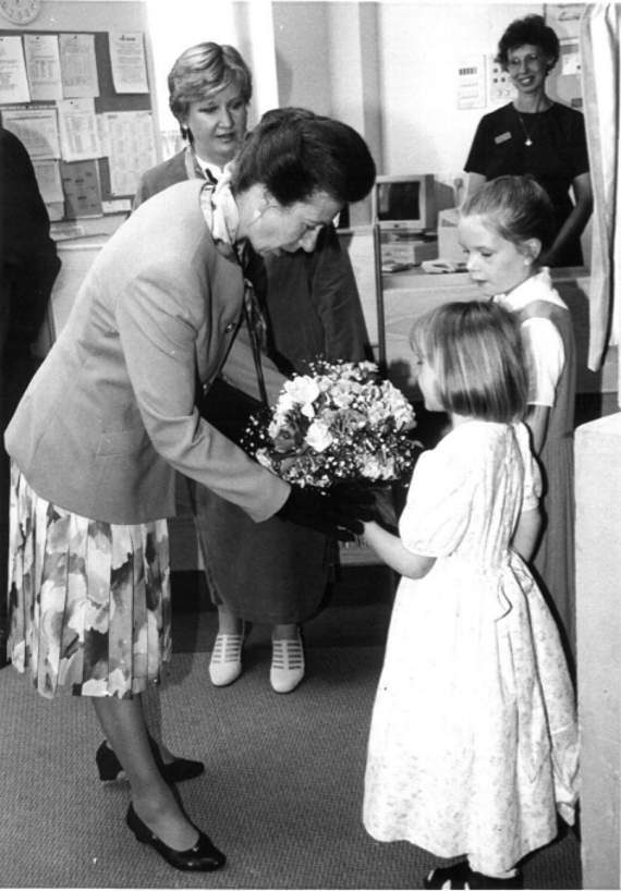 Penelope and Elizabeth Careless presenting a posy to Princess Anne