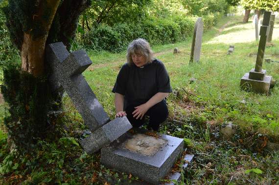 Reverend Jones with one of the damaged gravestones