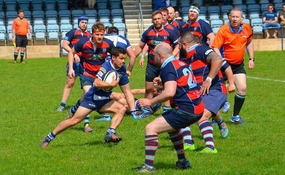 Marcus Barnard storms his way through the Dudley defence.