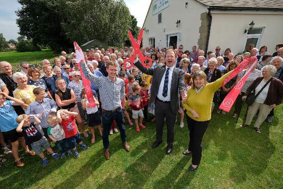 Jesse Norman MP for Hereford and South Herefordshire cuts the ribbon to open the new community shop with Shop Director, Andrew Gardner and Shop Manager, Jacky Bentham.