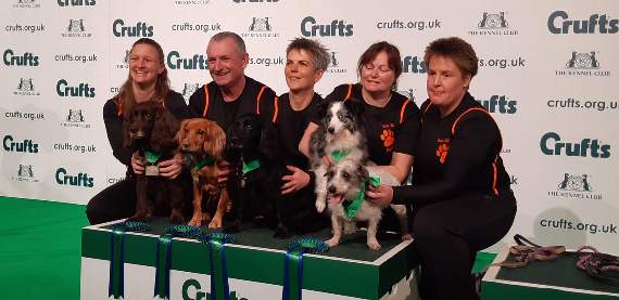 Sophie pictured centre with Kima, the black Working Cocker Spaniel