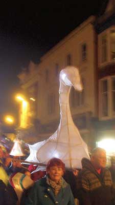 The candlelit procession winds its way through the streets of Dartmouth