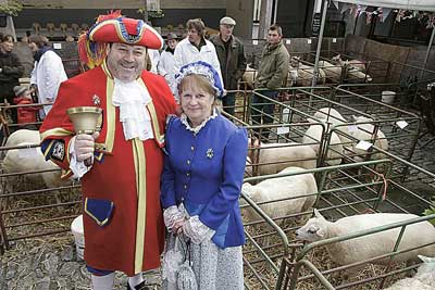 Town crier Lez Ellis with his wife Liz