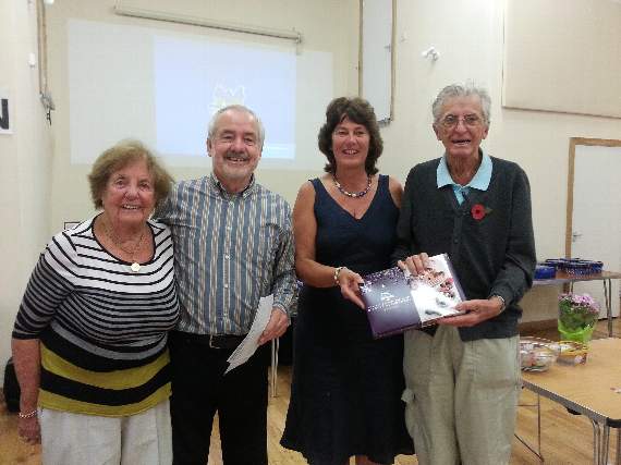 Caroline Hallett and Steve Dooley present the prize for the best individual score to Derek and Daphne Scorer.