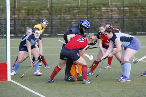 The Cougars' Chloe Harvey battles for possession